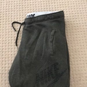 Army green Nike joggers